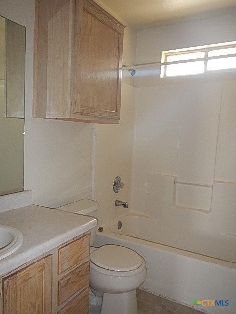 full bathroom with washtub / shower combination, vanity, and toilet