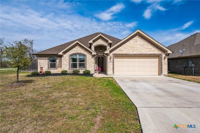 view of front facade with driveway, an attached garage, a front yard, and roof with shingles