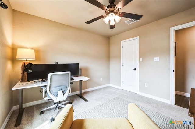 home office featuring a ceiling fan, carpet flooring, baseboards, and visible vents