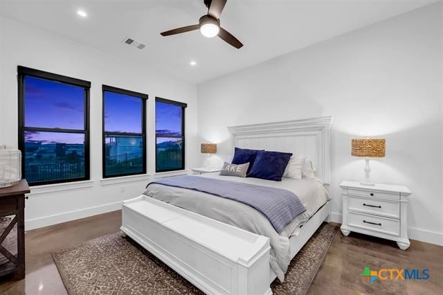 bedroom with ceiling fan and dark hardwood / wood-style flooring