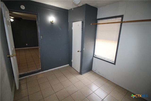 unfurnished bedroom featuring light tile patterned flooring