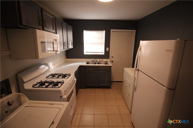 kitchen with washer / clothes dryer, sink, white appliances, and light tile patterned flooring