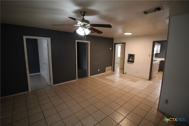 tiled empty room with ceiling fan