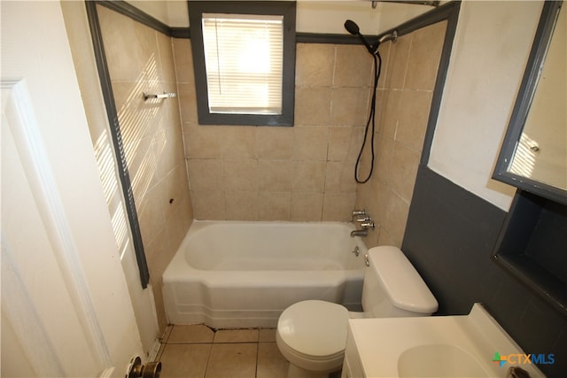 full bathroom with vanity, tile patterned floors, toilet, and tiled shower / bath