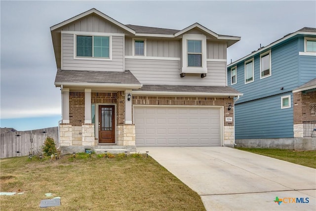 craftsman inspired home featuring a front lawn and a garage