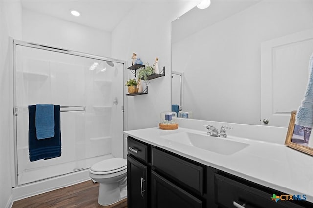 5806 Gulf Mdw, Converse, TX 78109 - full bathroom with a stall shower, wood finished floors, vanity, and recessed lighting