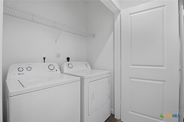 5806 Gulf Mdw, Converse, TX 78109 - laundry area with washing machine and clothes dryer and dark wood-style flooring