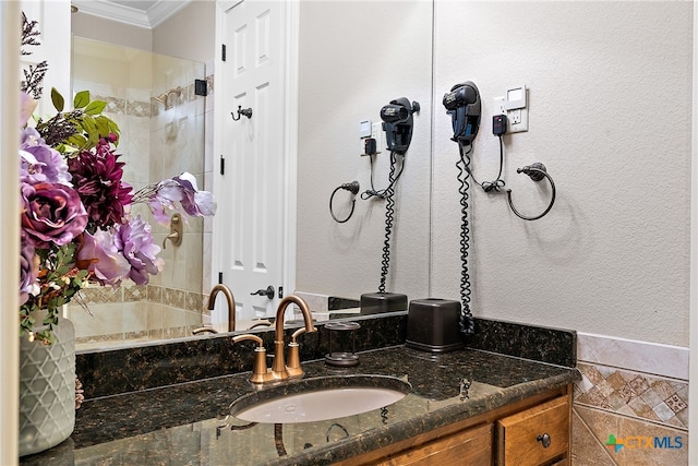 bathroom with vanity and crown molding