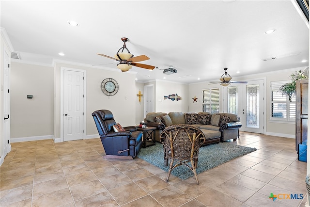 tiled living room with ceiling fan and crown molding