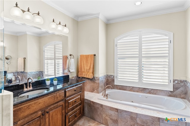 bathroom featuring tiled bath, tile patterned flooring, vanity, and crown molding