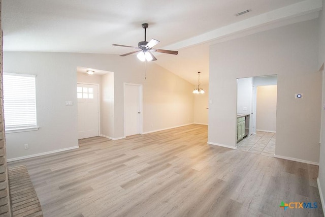 unfurnished living room featuring ceiling fan with notable chandelier, baseboards, lofted ceiling, light wood-type flooring, and visible vents