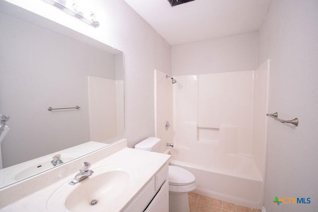 bathroom featuring vanity, washtub / shower combination, and toilet