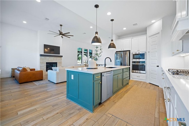 385 Althea, New Braunfels, TX 78132 - kitchen featuring stainless steel appliances, white cabinetry, ceiling fan, light wood finished floors, and recessed lighting