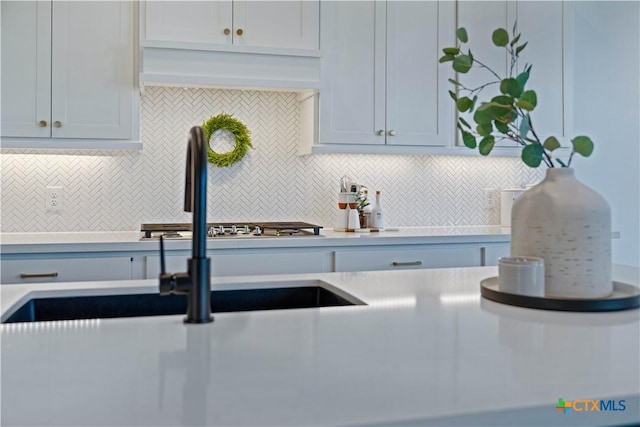 385 Althea, New Braunfels, TX 78132 - kitchen featuring tasteful backsplash, light countertops, and a sink