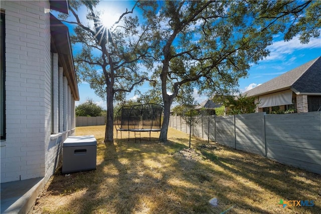 385 Althea, New Braunfels, TX 78132 - view of yard featuring a trampoline