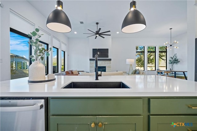 385 Althea, New Braunfels, TX 78132 - kitchen with green cabinets, dishwasher, a sink, open floor plan, and recessed lighting