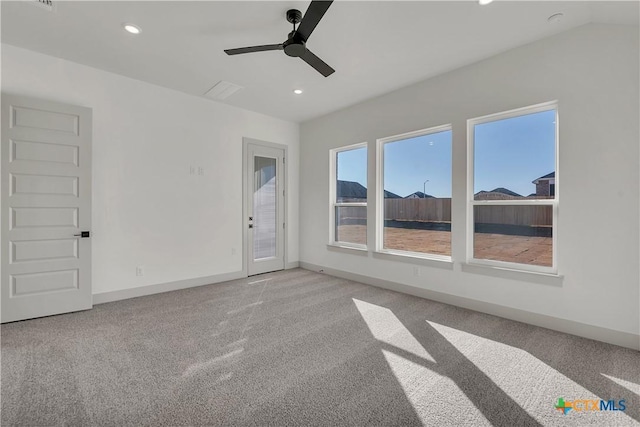 empty room with ceiling fan and light carpet