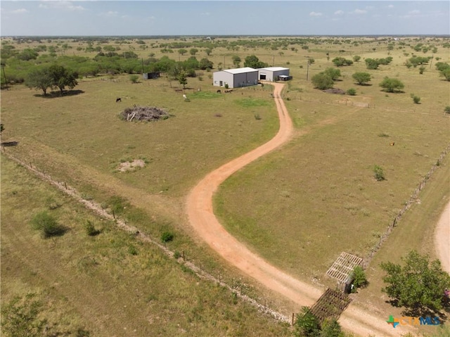 birds eye view of property featuring a rural view