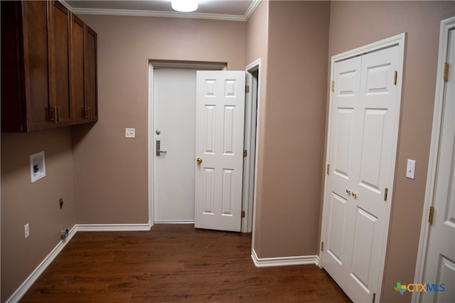 clothes washing area with washer hookup, crown molding, cabinet space, dark wood-type flooring, and baseboards