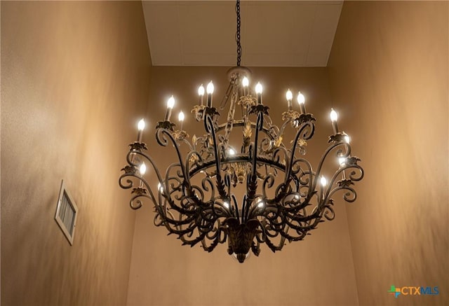 interior details with a chandelier and visible vents