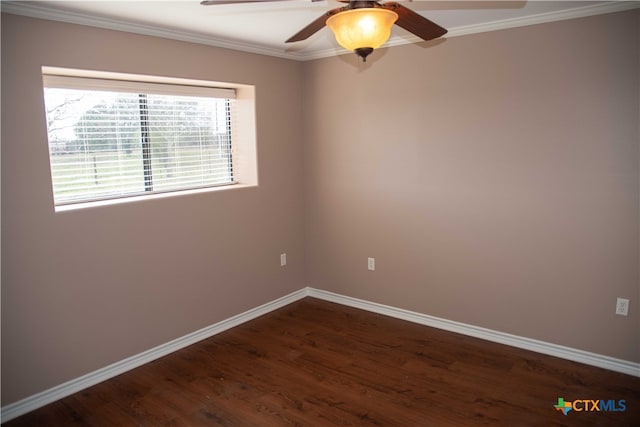 empty room featuring crown molding, dark wood finished floors, baseboards, and a ceiling fan