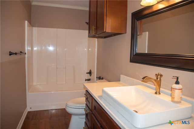 full bath featuring toilet, shower / tub combination, ornamental molding, wood finished floors, and vanity