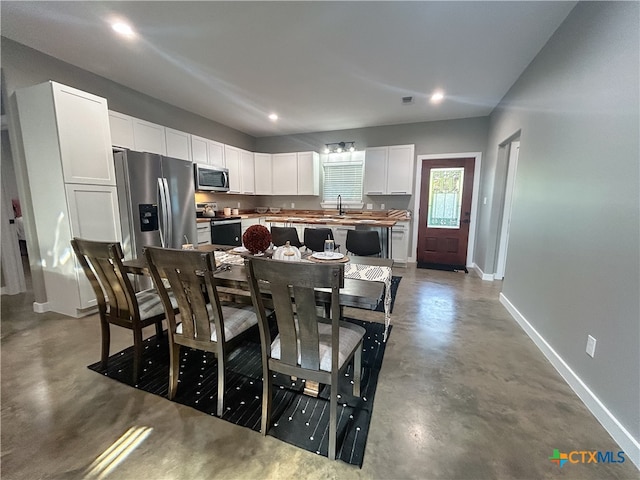 dining area with concrete flooring and sink