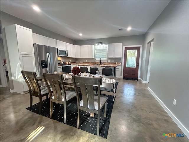 3306 Cypress, Victoria, TX 77901 - dining room with concrete flooring and recessed lighting
