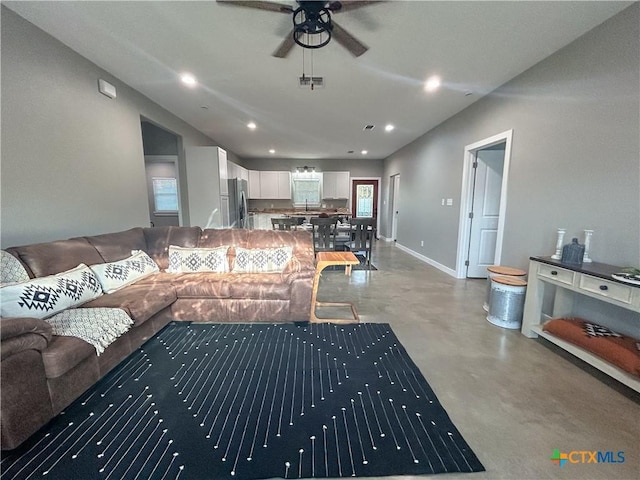3306 Cypress, Victoria, TX 77901 - living room featuring finished concrete flooring, a ceiling fan, and recessed lighting