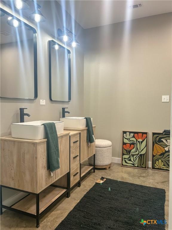 3306 Cypress, Victoria, TX 77901 - bathroom featuring double vanity and baseboards