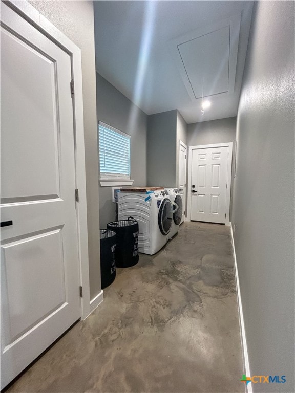 clothes washing area with independent washer and dryer