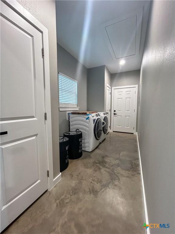 3306 Cypress, Victoria, TX 77901 - laundry area featuring attic access and washer and dryer