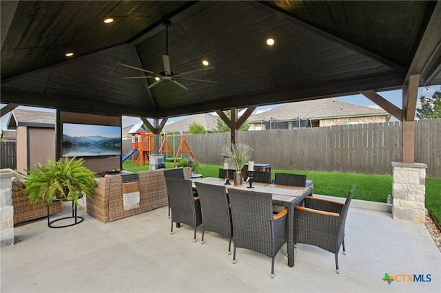 5106 La Piedra Ln, Killeen, TX 76549 - fenced backyard featuring a patio area, a playground, a ceiling fan, and outdoor dining space