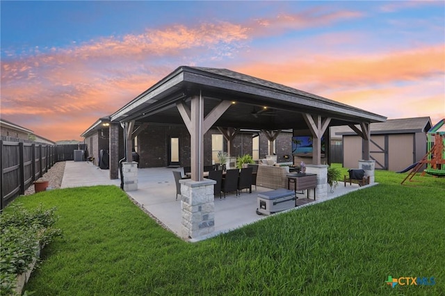 5106 La Piedra Ln, Killeen, TX 76549 - rear view of house featuring a gazebo, an outdoor hangout area, a patio, a playground, and a fenced backyard