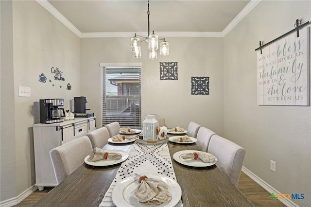 5106 La Piedra Ln, Killeen, TX 76549 - dining space featuring wood finished floors, crown molding, and a chandelier