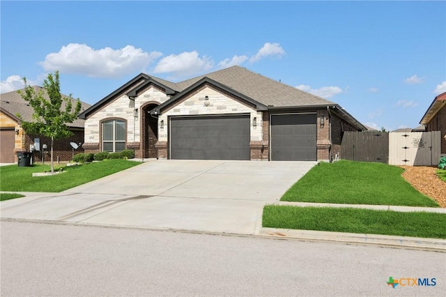 5106 La Piedra Ln, Killeen, TX 76549 - french provincial home with an attached garage, driveway, a gate, and brick siding