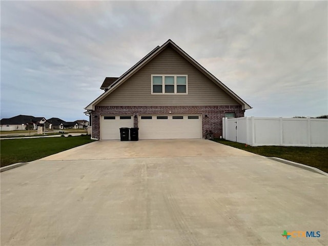 view of side of property featuring a garage