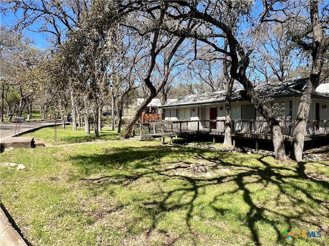 view of yard with a wooden deck