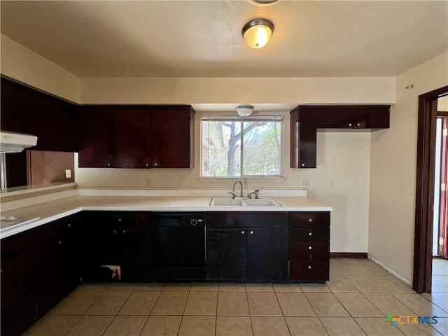 kitchen with light tile patterned floors, a sink, light countertops, dark brown cabinets, and black dishwasher