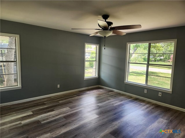 325 Montgomery St, Yoakum, TX 77995 - spare room with dark wood-style floors and ceiling fan