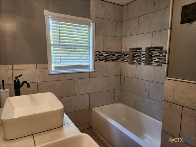 325 Montgomery St, Yoakum, TX 77995 - bathroom with a tub and tile walls
