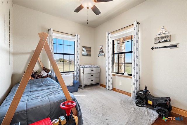 carpeted bedroom featuring ceiling fan