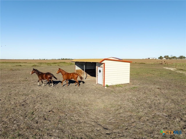 view of outdoor structure featuring a rural view