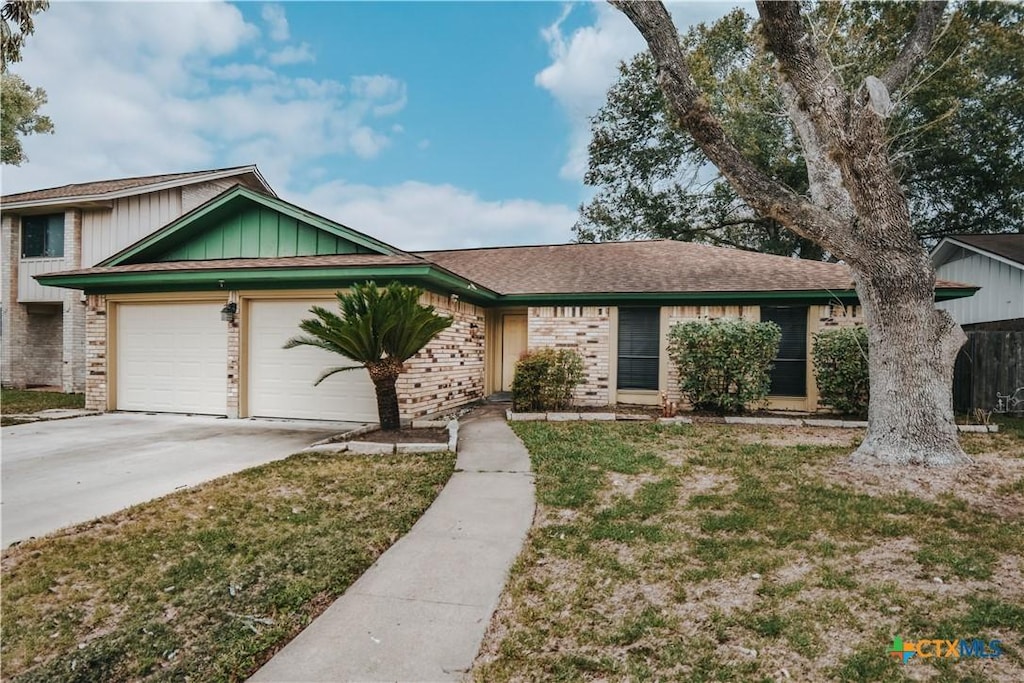 single story home featuring a garage