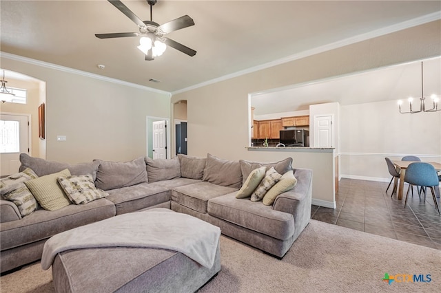 1921 Merlin Dr, Harker Heights, TX 76548 - living room featuring a chandelier, crown molding, dark tile patterned floors, baseboards, and ceiling fan