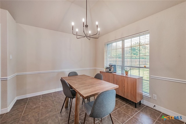 1921 Merlin Dr, Harker Heights, TX 76548 - dining space featuring lofted ceiling, a chandelier, plenty of natural light, dark tile patterned flooring, and baseboards