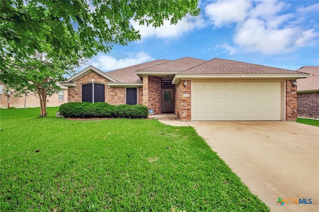 1921 Merlin Dr, Harker Heights, TX 76548 - ranch-style home featuring concrete driveway, a front lawn, a garage, and brick siding