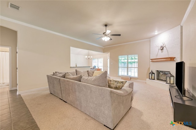 1921 Merlin Dr, Harker Heights, TX 76548 - tiled living room featuring ornamental molding, a ceiling fan, a fireplace, carpet floors, and baseboards