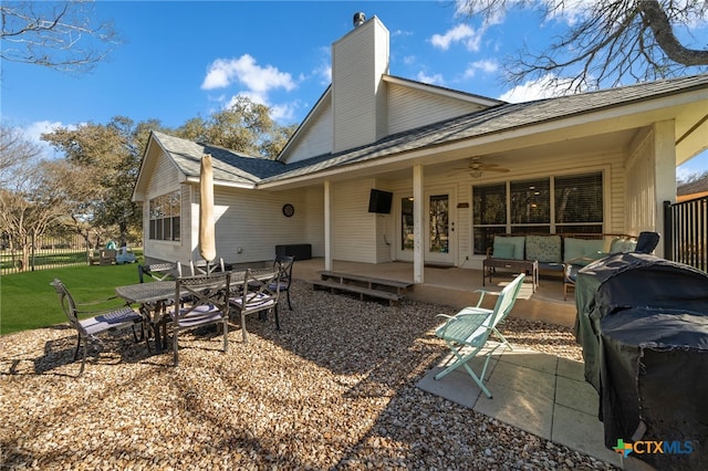 back of house with a patio area, outdoor lounge area, and ceiling fan