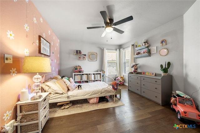 bedroom featuring dark hardwood / wood-style floors and ceiling fan